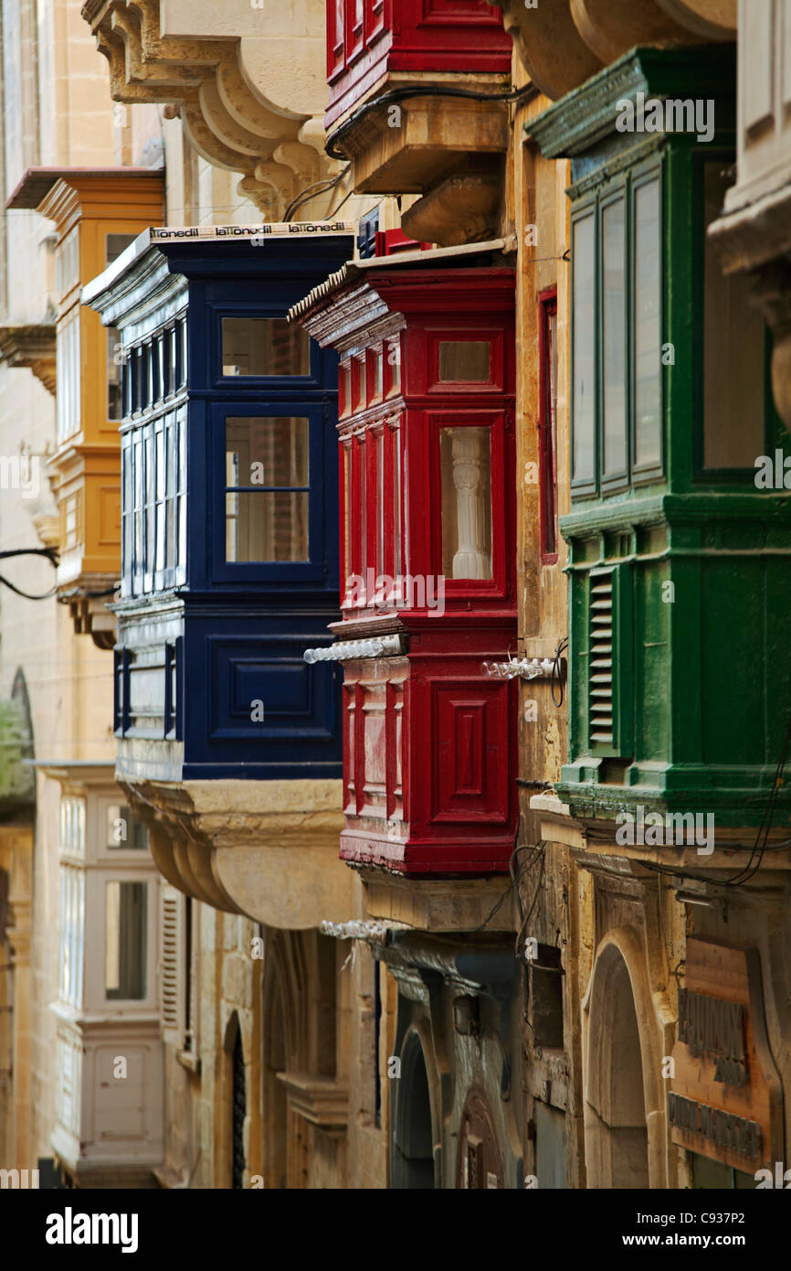 Malta, Europe; Coloured wooden Maltese balconies in the streets of