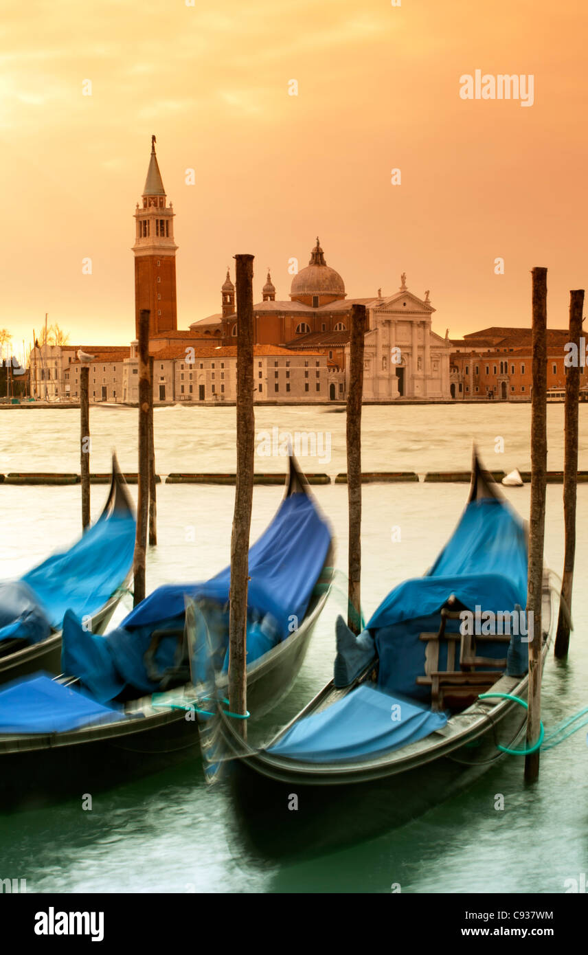 Venice, Veneto, Italy; Gondolas tied to the Bacino di San Marco in early morning. Stock Photo