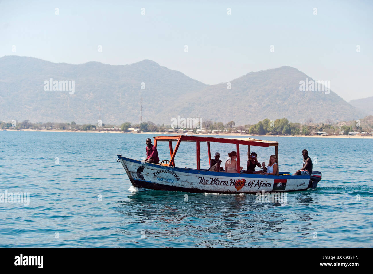 Malawi, Lake Malawi National Park.  Pleasure boat from Cape Maclear takes tourists out to do snorkelling on Lake Malawi. Stock Photo
