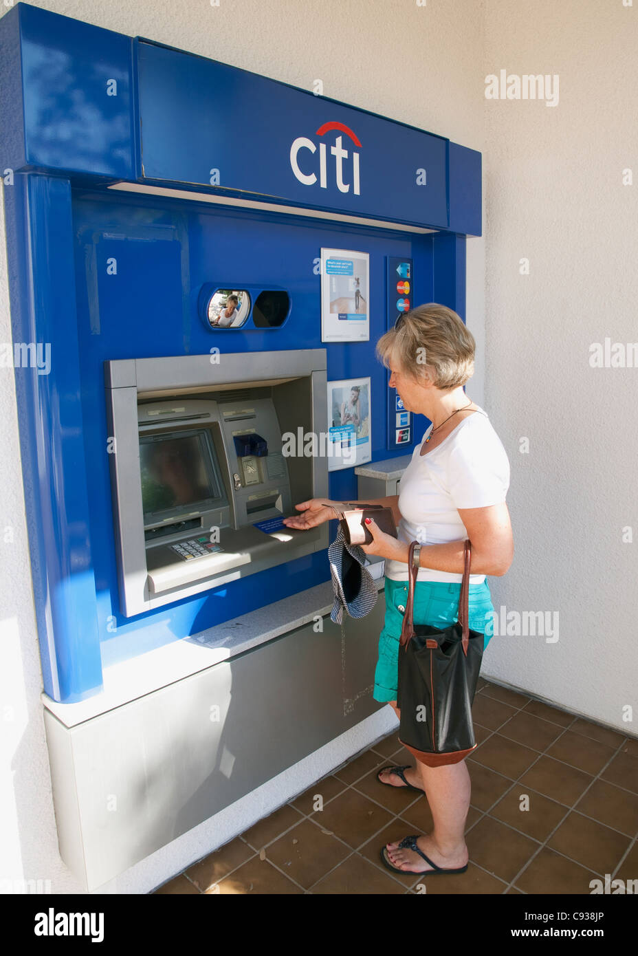 Withdrawing cash from a Citibank cash machine. Stock Photo