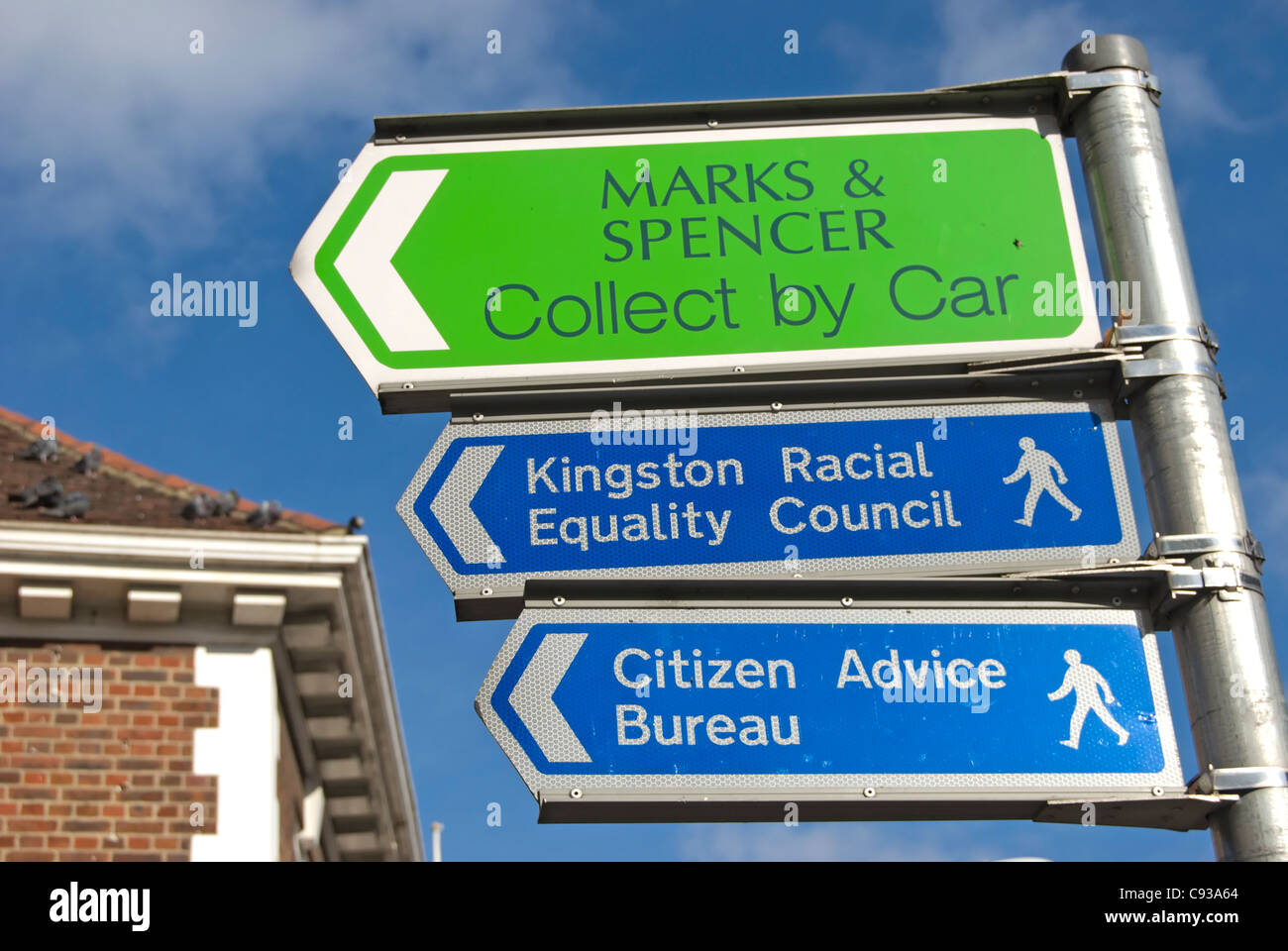 three left pointing direction signs in kingston upon thames, surrey
