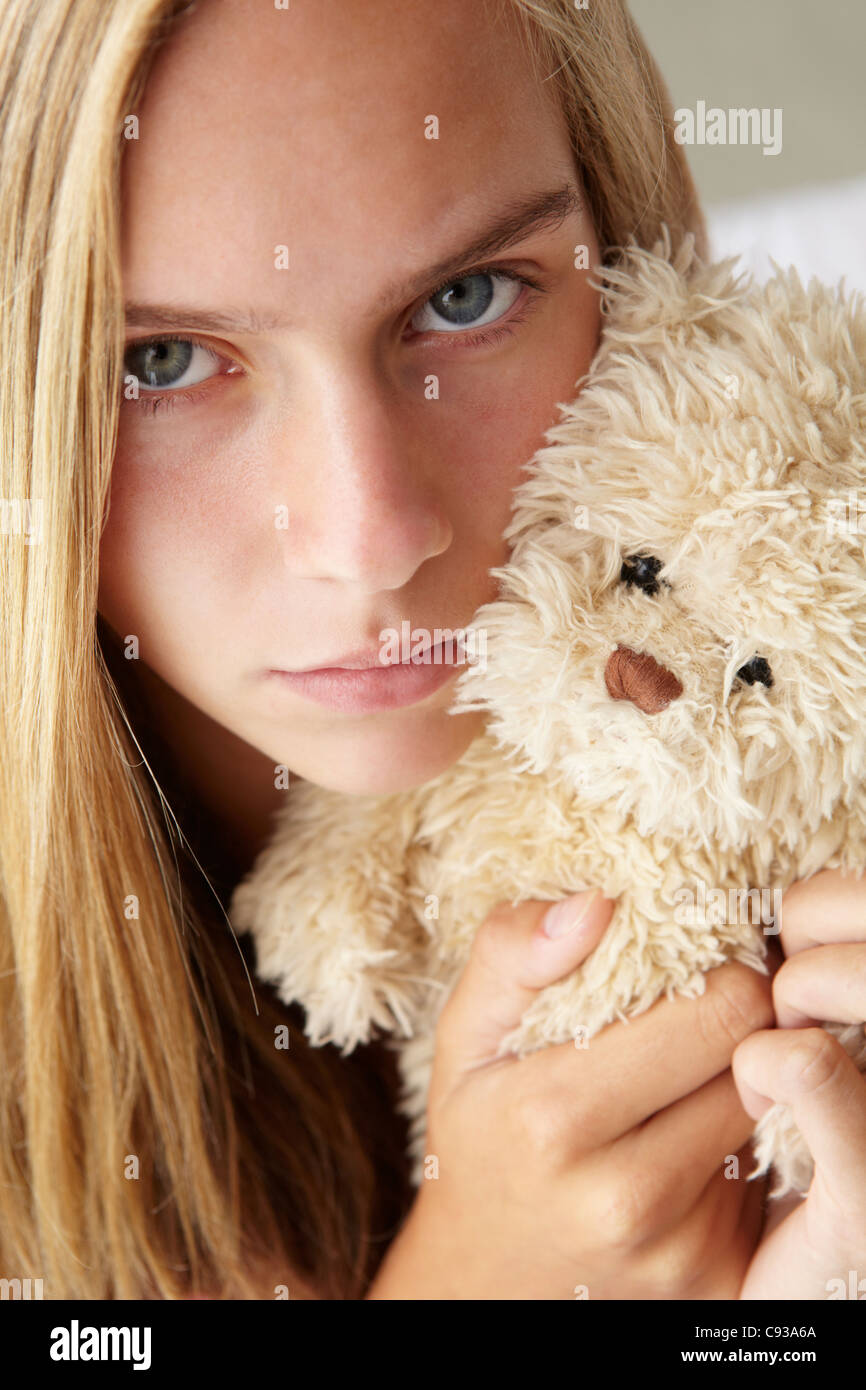 Unhappy teenage girl with cuddly toy Stock Photo