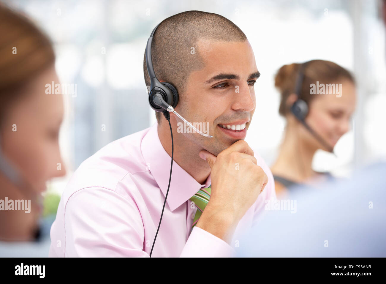Young businessman wearing headset Stock Photo
