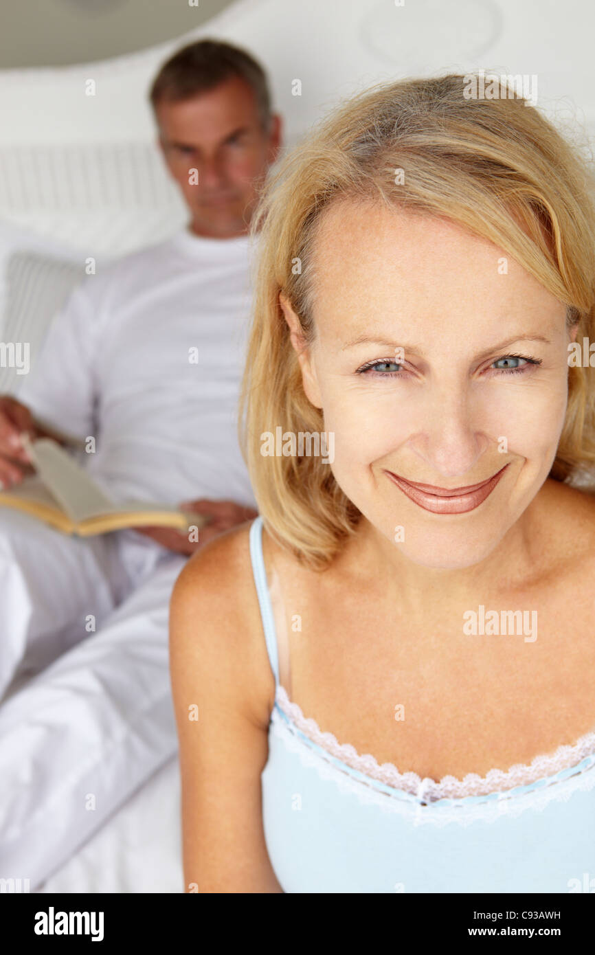 Mid age couple in bedroom Stock Photo