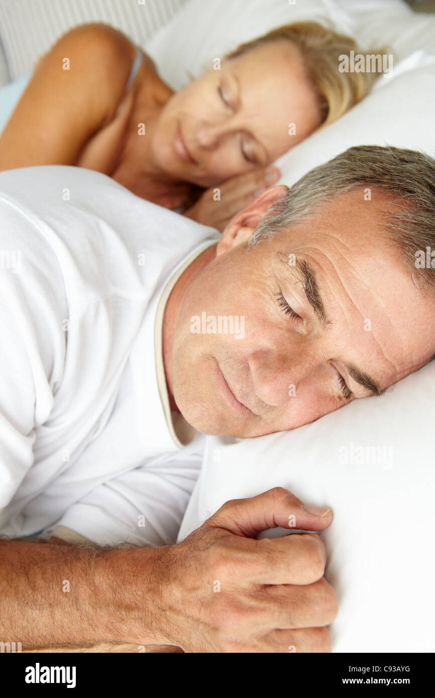 Head and shoulders mid age couple sleeping Stock Photo