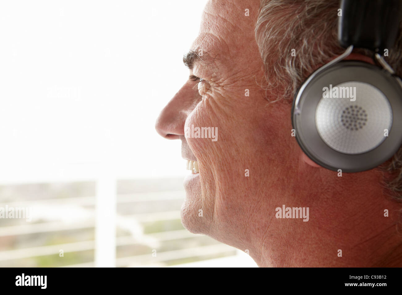 Mid age man wearing headphones Stock Photo