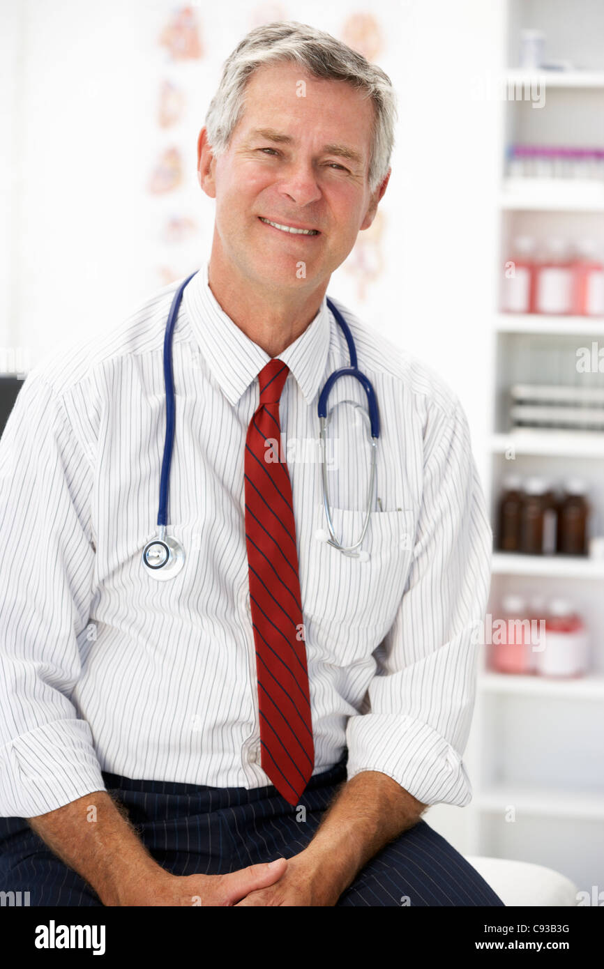 Senior doctor in consulting room Stock Photo