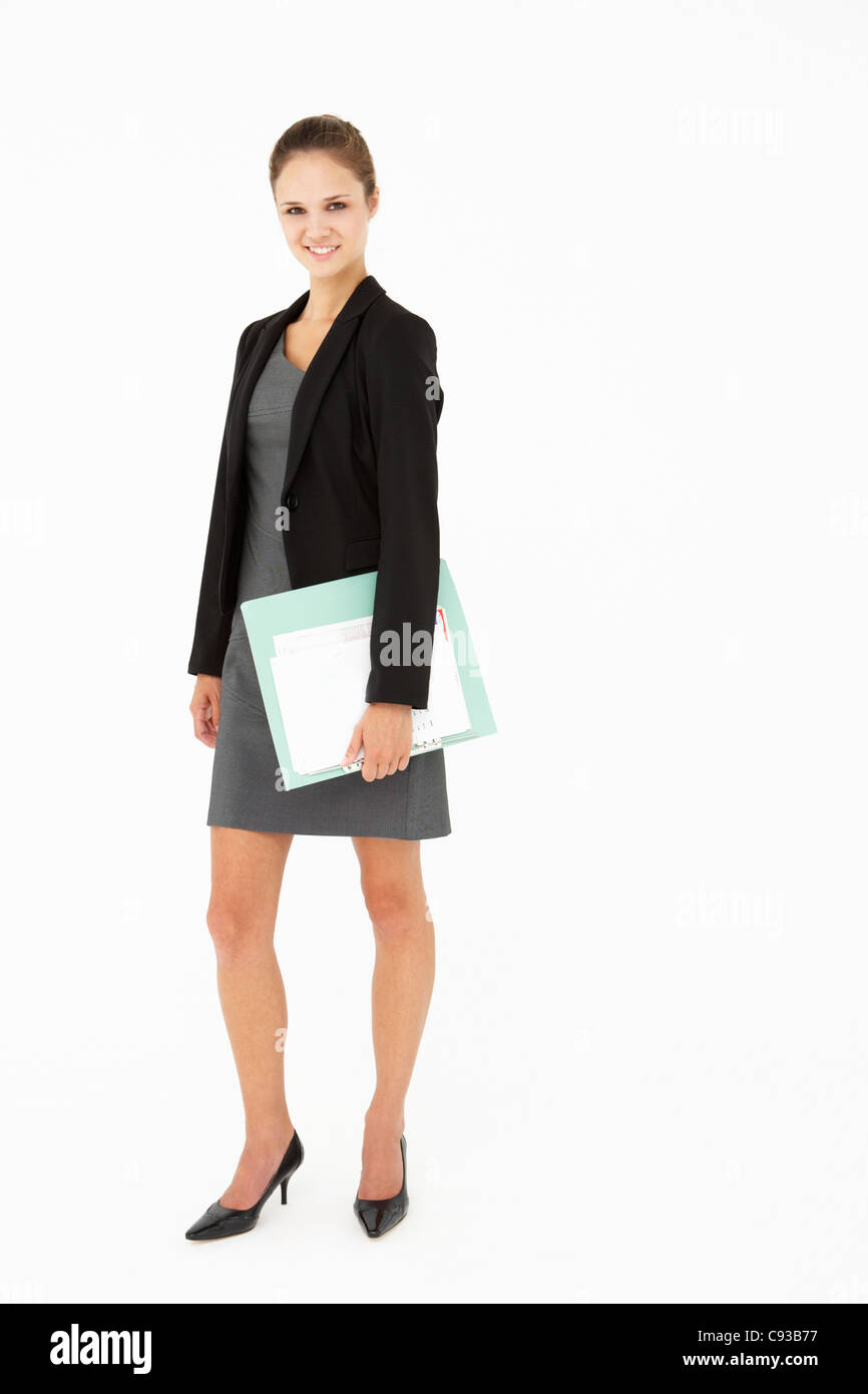 Young businesswoman carrying folder Stock Photo