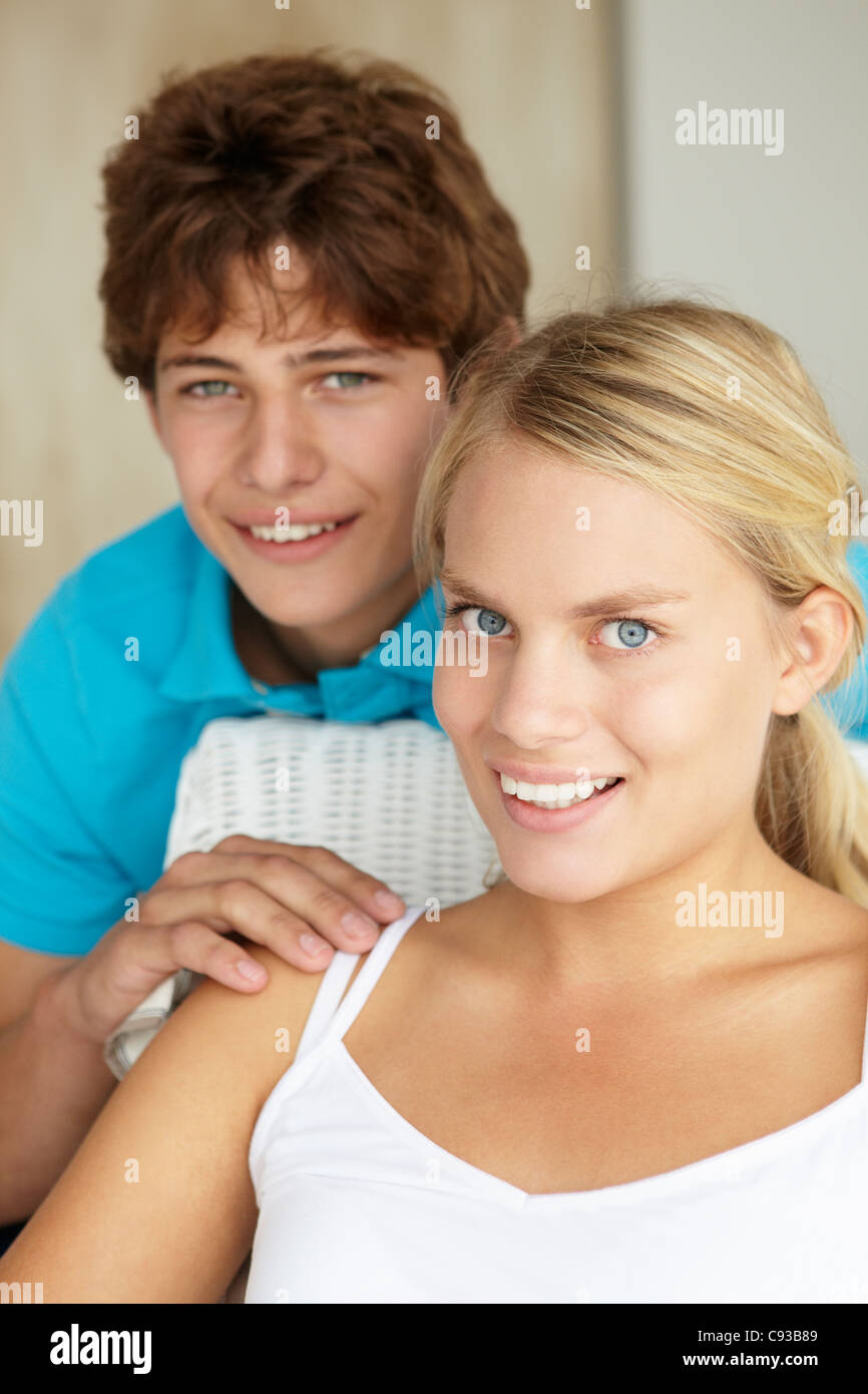 Portrait teenage girl and boy at home Stock Photo - Alamy