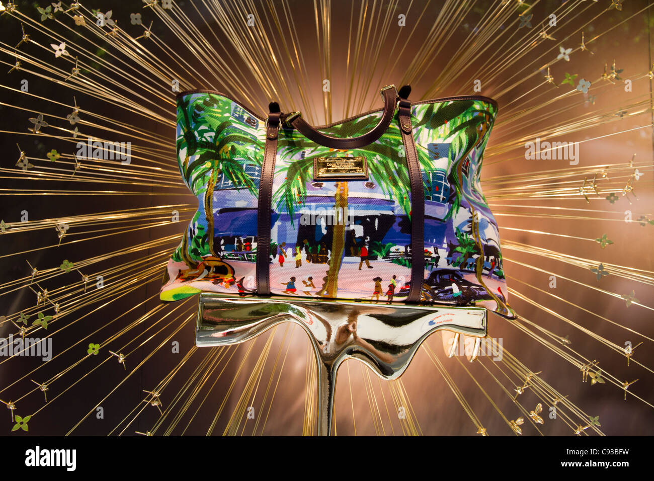 Louis Vuitton bag displayed in luxury shopping boutique storefront window in Palma de Mallorca