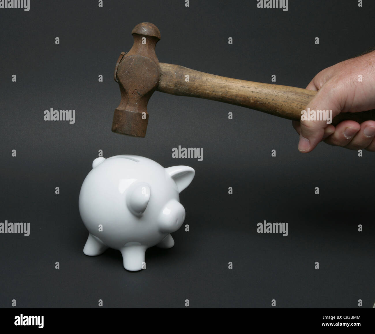 piggy bank & hammer Stock Photo - Alamy