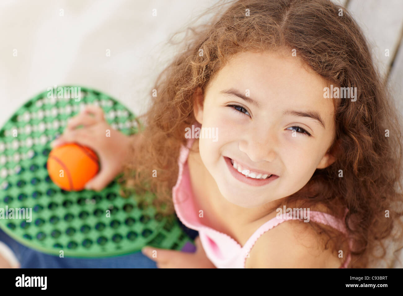 Little girl outdoors with bat and ball Stock Photo Alamy