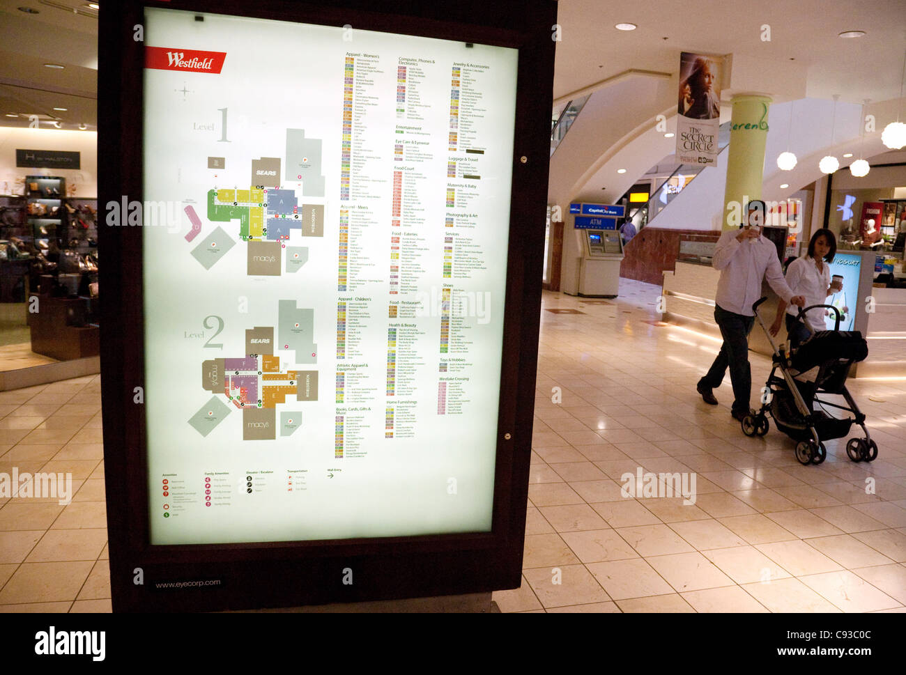 shoppers walking past the  information sign, Westfield Montgomery Shopping Mall, Washington DC USA Stock Photo