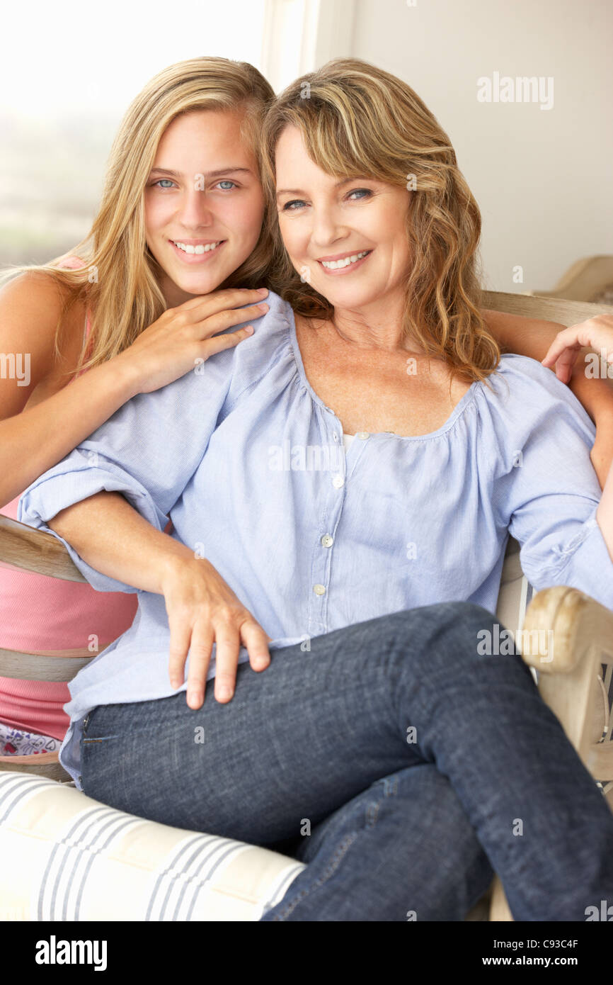 Mid age woman and teenage daughter at home Stock Photo