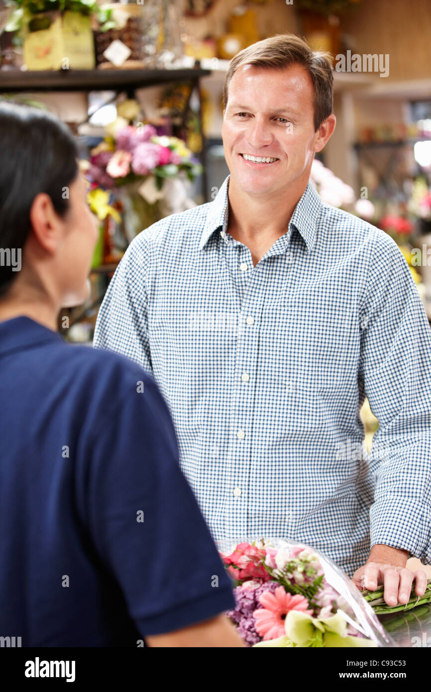 Man serving customer in florist Stock Photo