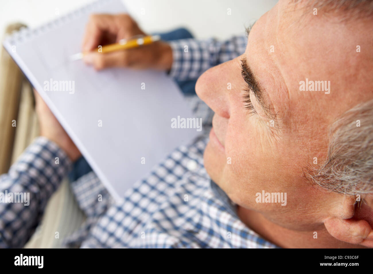 Mid age man sketching Stock Photo