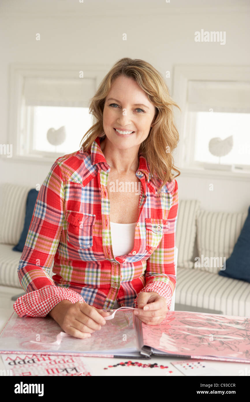 Mid age woman scrapbooking Stock Photo