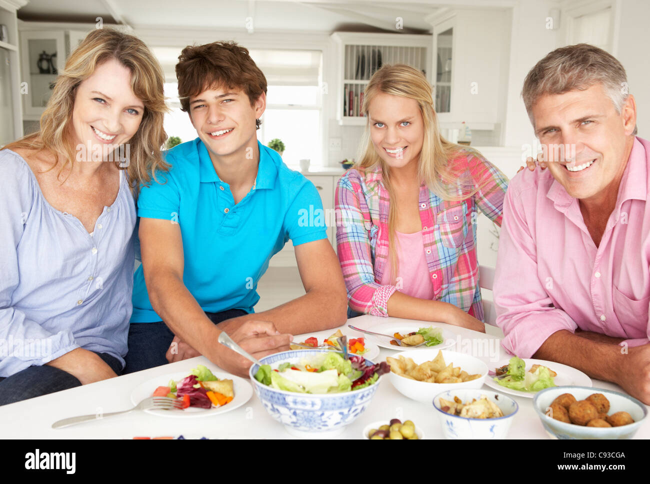 Family enjoying meal at home Stock Photo - Alamy