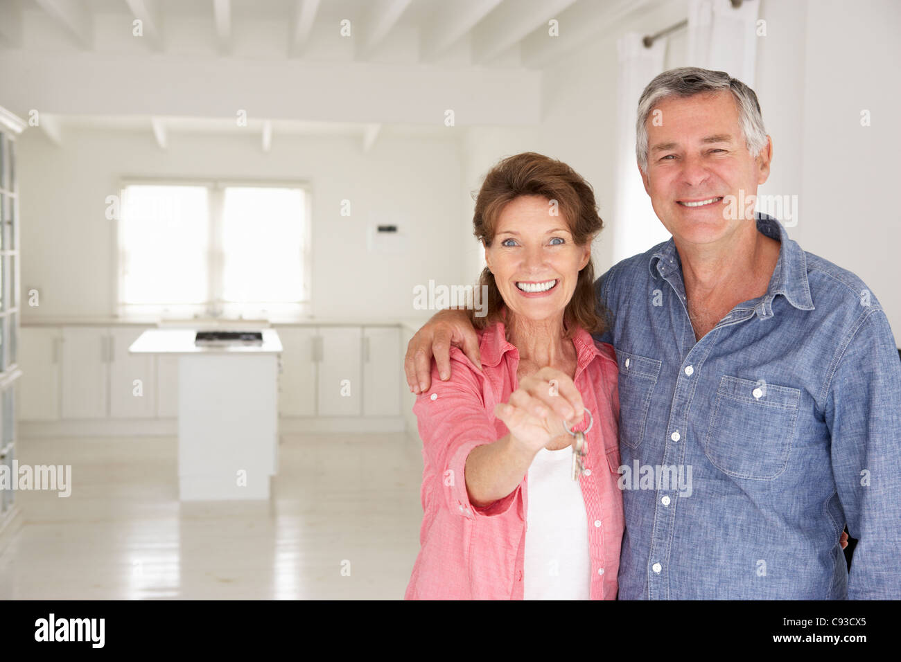 Senior couple in new home Stock Photo - Alamy