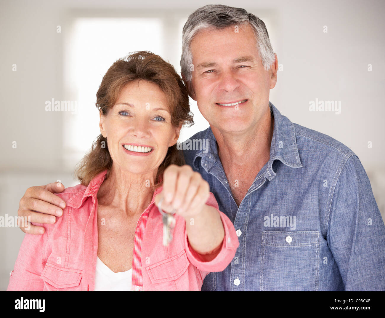 Senior couple moving into new home Stock Photo - Alamy