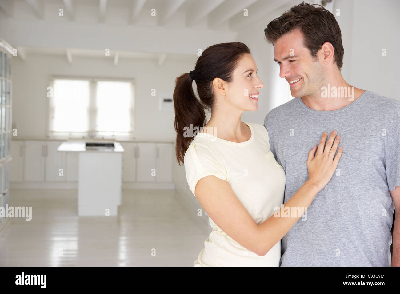 Couple in new home Stock Photo - Alamy
