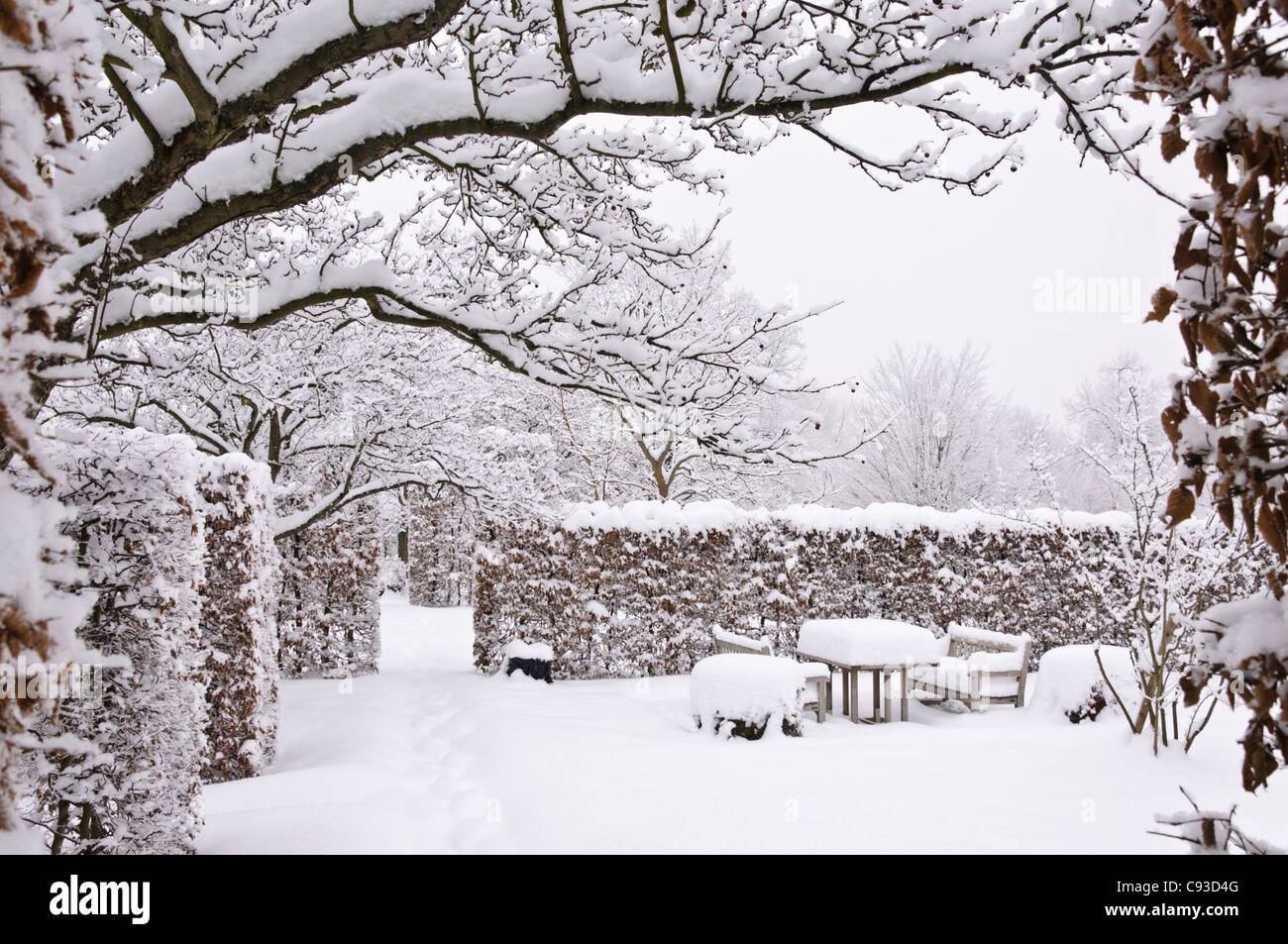 Snowy garden with seating area Stock Photo