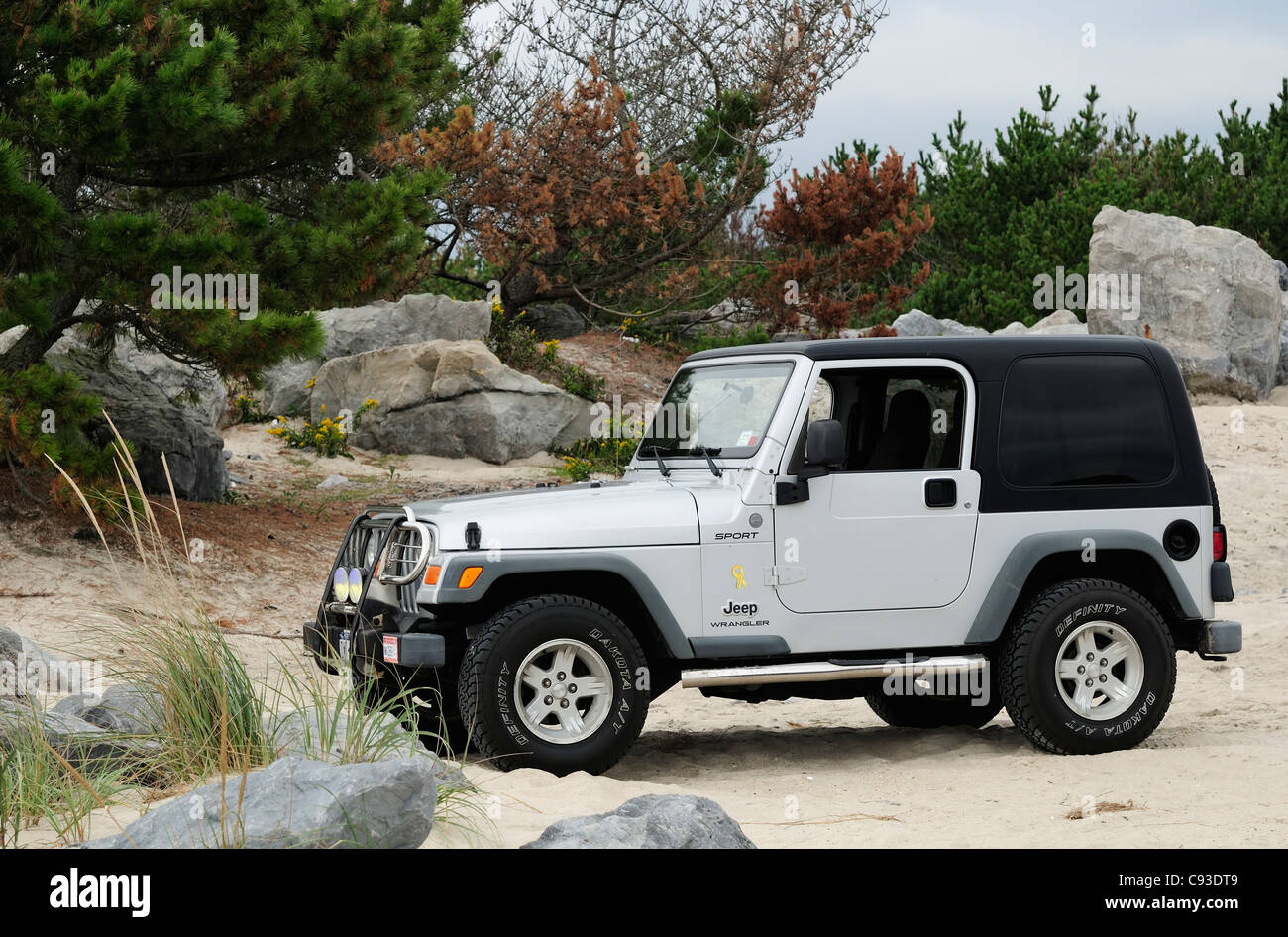 Jeep Wrangler on the beach in the Moriches inlet, Long Island, NY Stock Photo