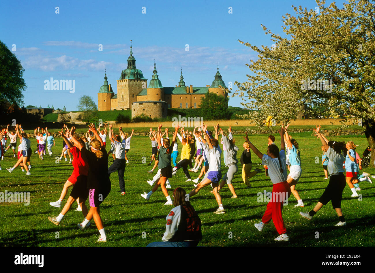 Outdoor exercise and aerobic classes near Kalmar Castle in city of Kalmar in the province of Småland in Sweden. Stock Photo