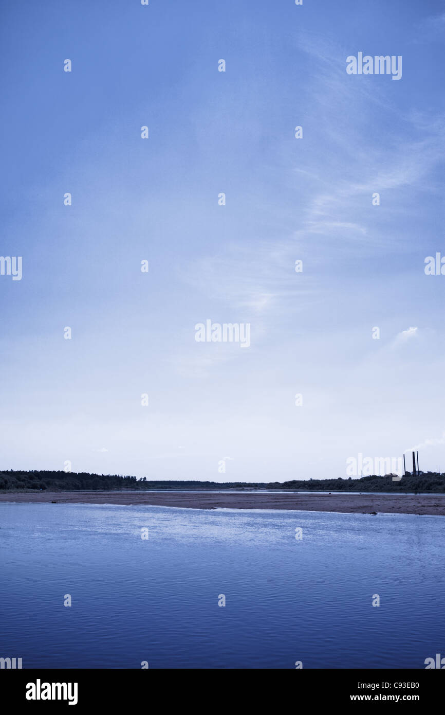 calm river under blue sky at summer night Stock Photo