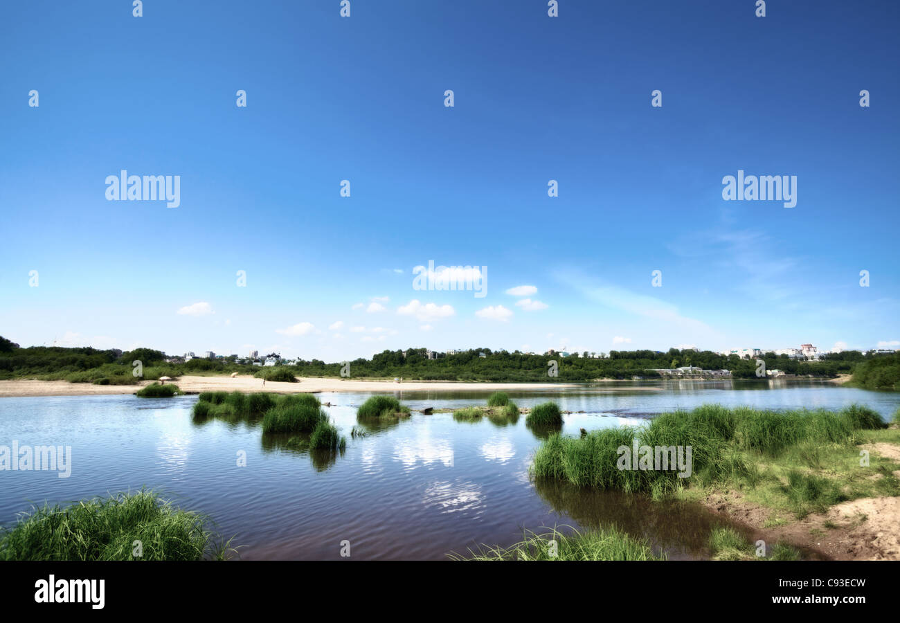 calm river under blue sky at summer day Stock Photo