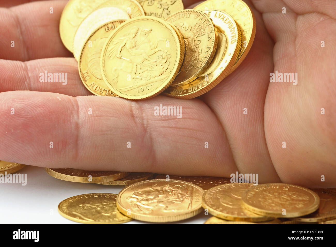hand with gold coins Stock Photo