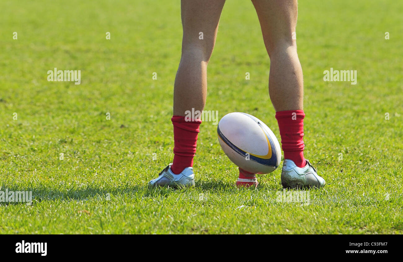 A Rugby Players Legs Preparing To Kick A Rugby Ball C93FM7 