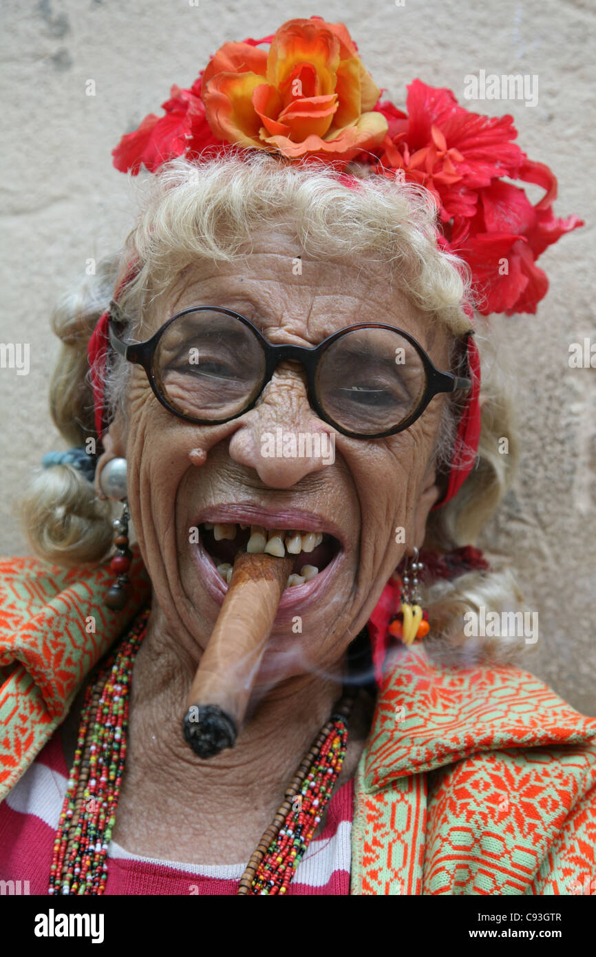 Eccentric Old Cuban Woman Smoking Cigar In The Historical Centre Of Havana Cuba Eccentric Old Cuban Woman Smoking Cigar In The Historical Centre Of Havana Cuba