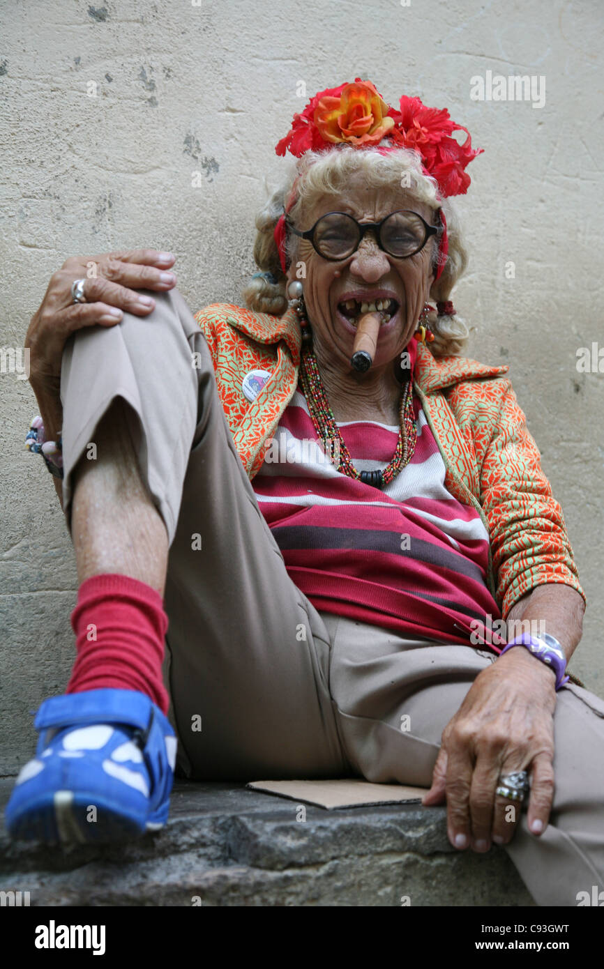 eccentric-old-cuban-woman-smoking-cigar-in-the-historical-centre-of-C93GWT.jpg