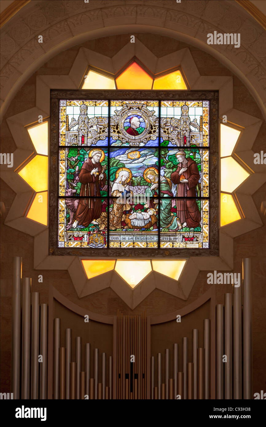 The stained glass window behind the altar at St. Catherine church