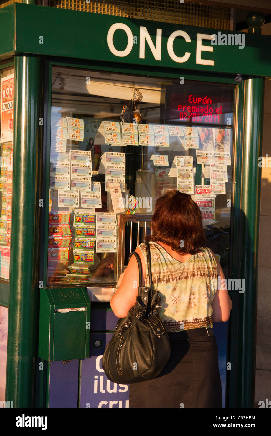 Person buying tickets at Once Lottery cabin kiosk Palma de Mallorca Spain Stock Photo