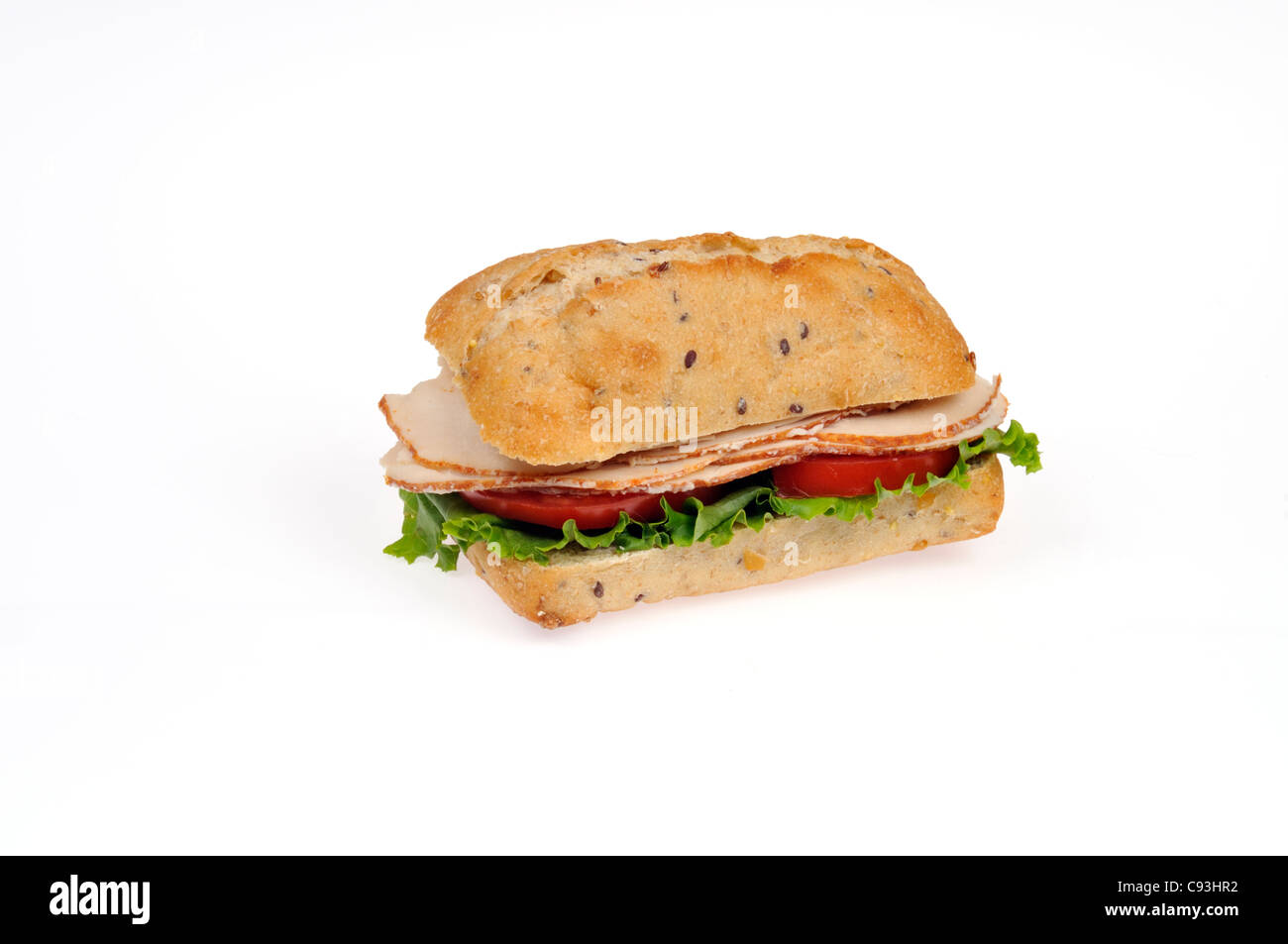 Chicken deli sandwich with lettuce & tomato in ciabatta roll on white background cutout Stock Photo