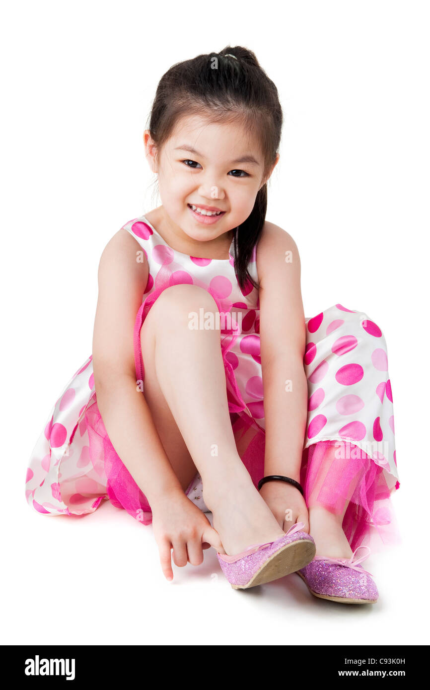 Child putting on shoe Cut Out Stock Images & Pictures Alamy