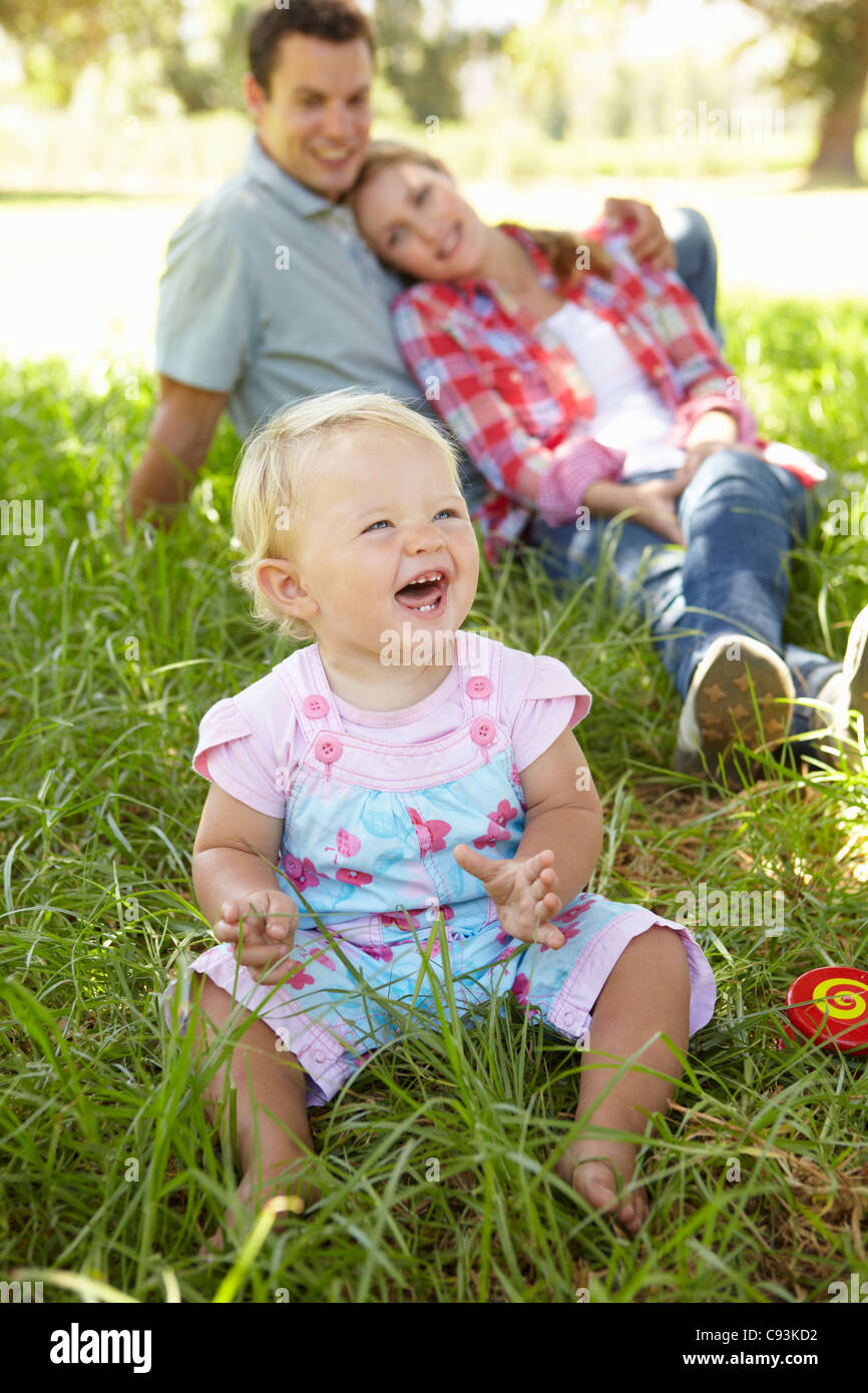 Parents and toddler outdoors Stock Photo