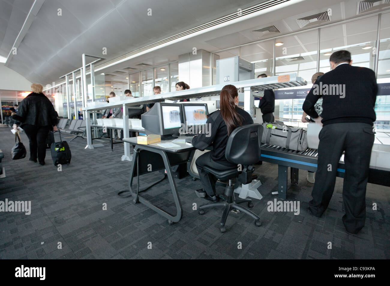 Airport security staff check passengers baggage at departure gate in Istanbul, Turkey, March 22, 2011. Stock Photo