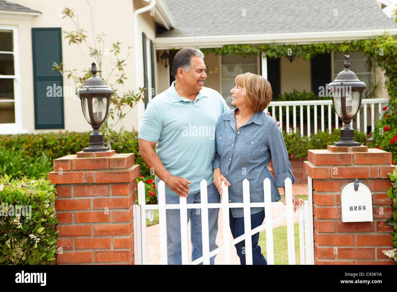 Senior Hispanic couple outside home Stock Photo - Alamy