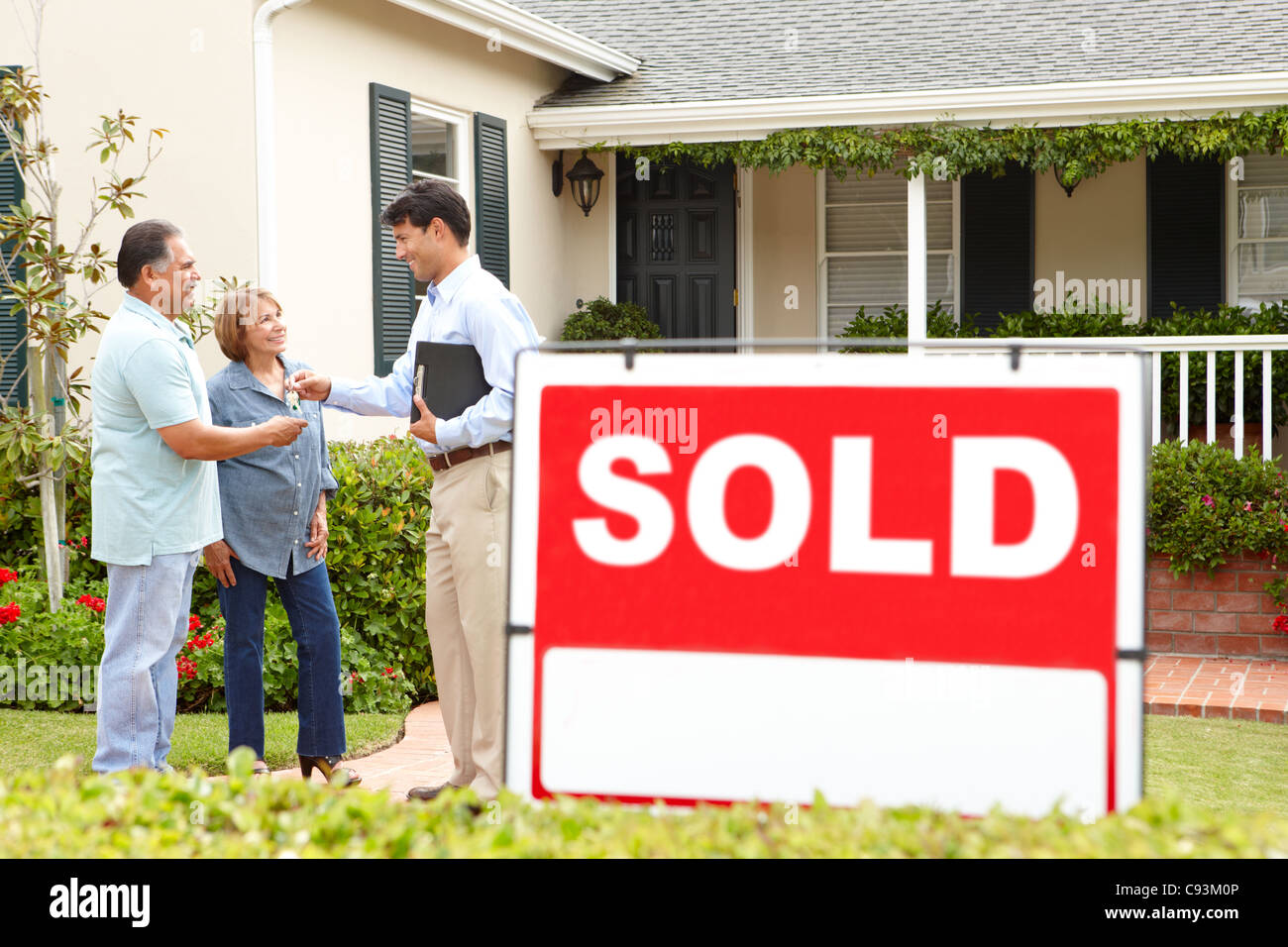Hispanic senior couple outside house hi-res stock photography and ...