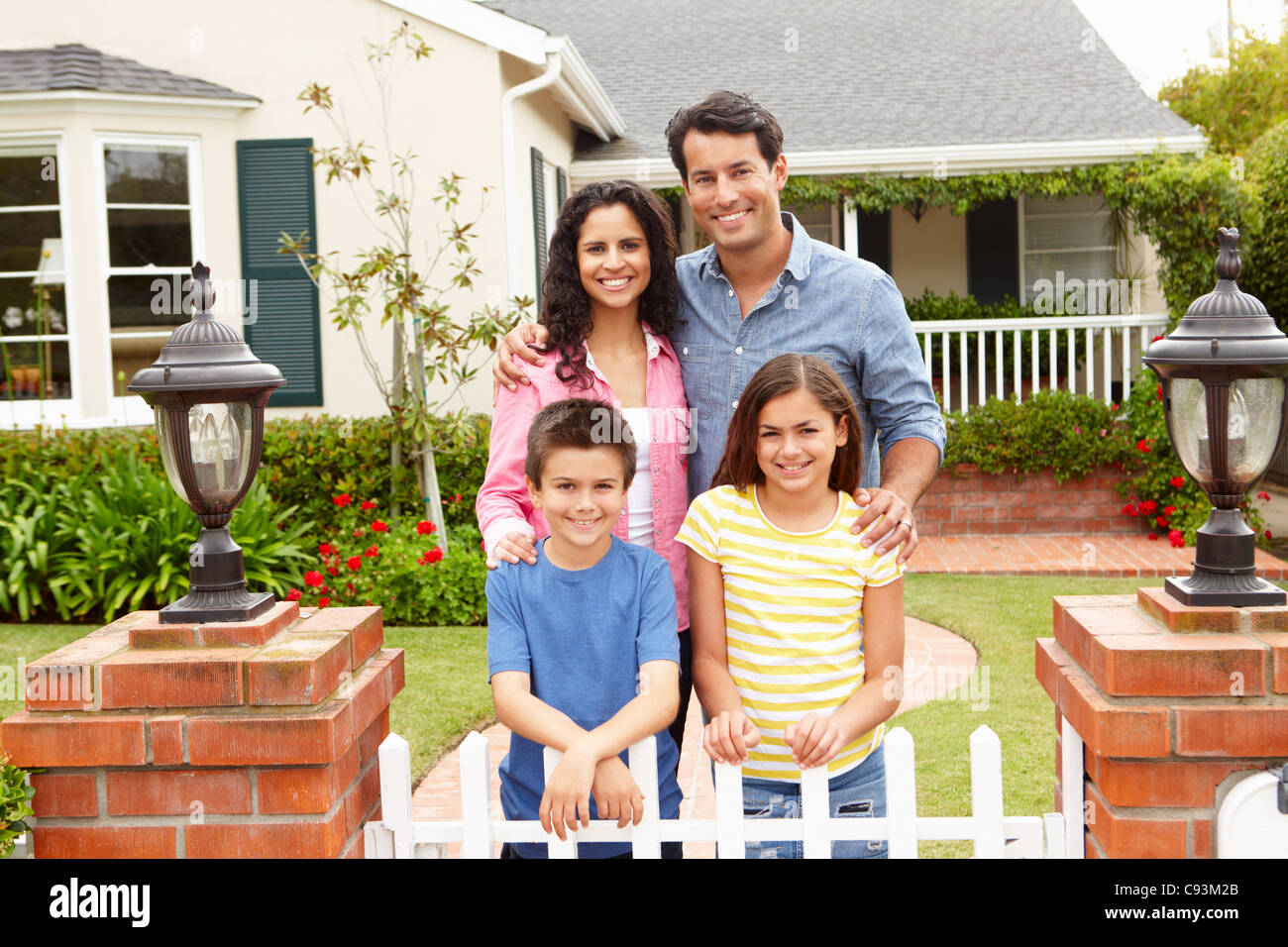 Hispanic family outside home Stock Photo - Alamy