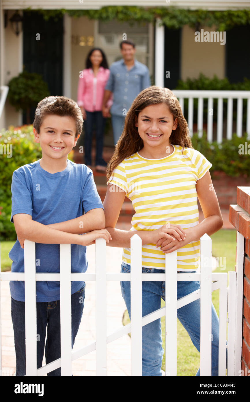 Hispanic family outside home Stock Photo - Alamy
