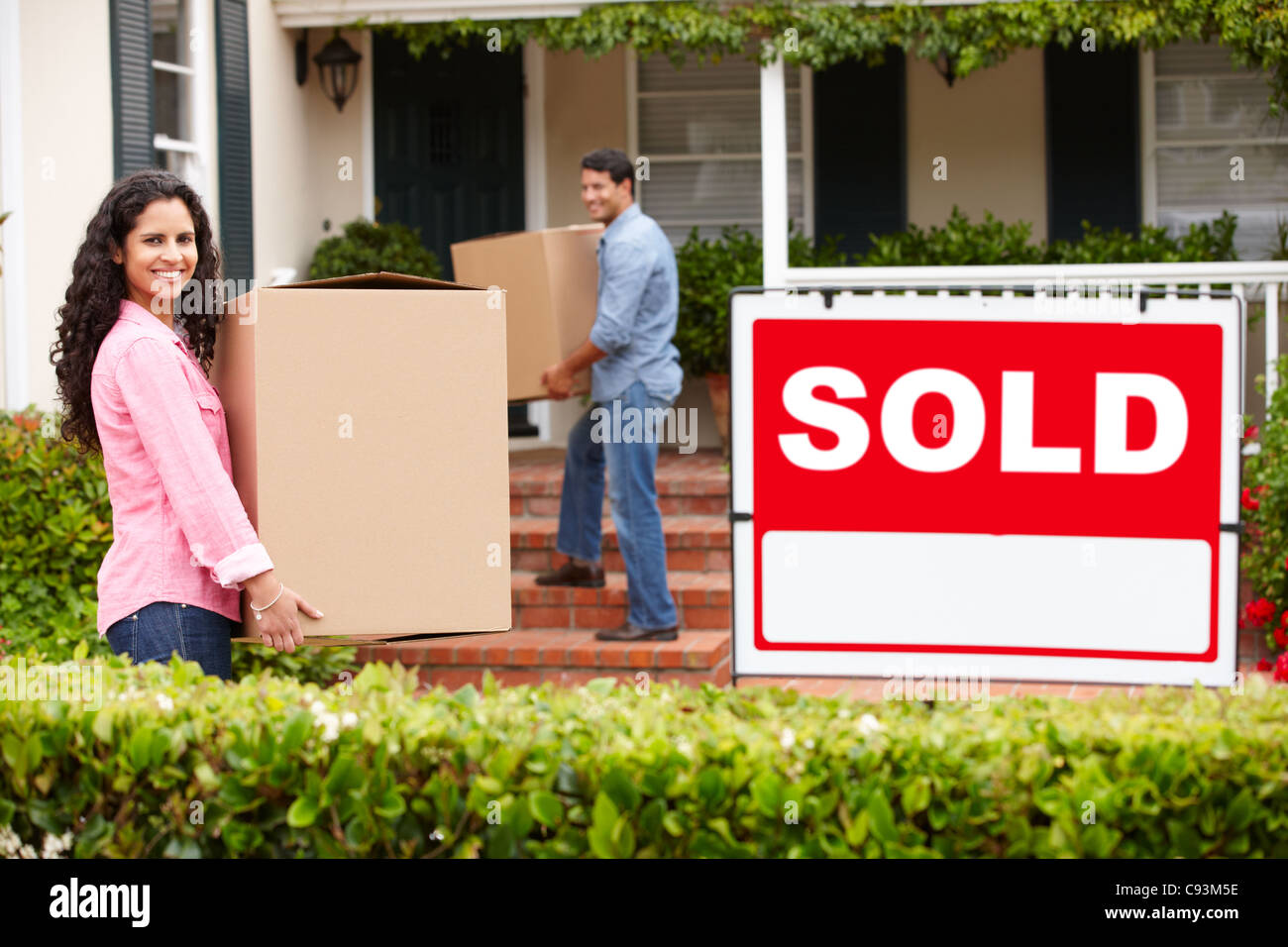 Couple moving into new home Stock Photo - Alamy