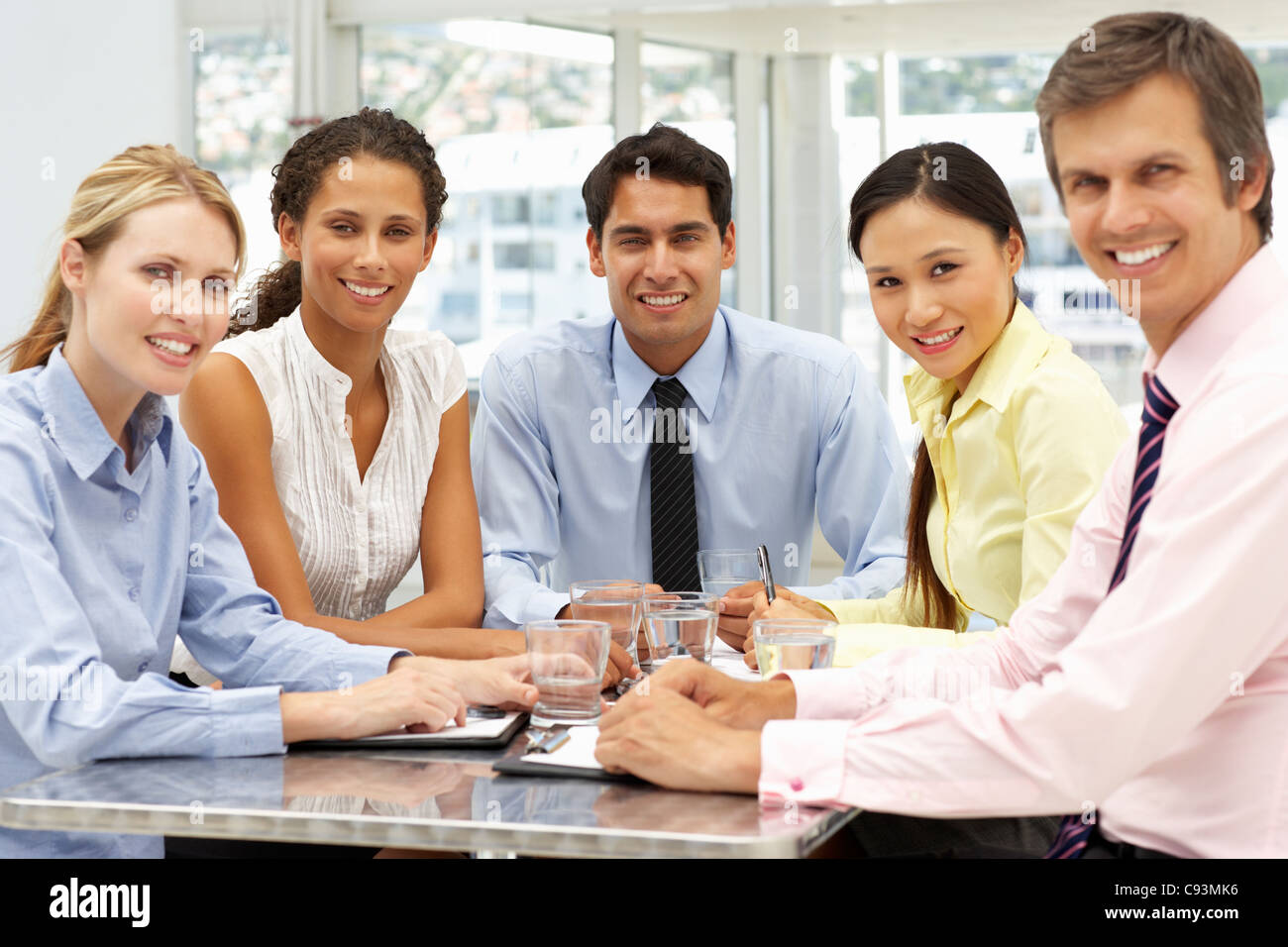 Mixed group in business meeting Stock Photo Alamy