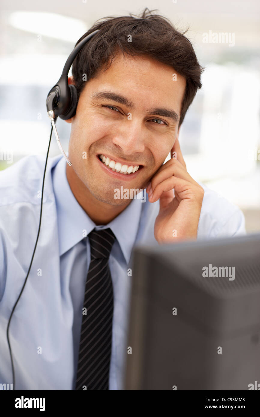 Businessman wearing headset Stock Photo