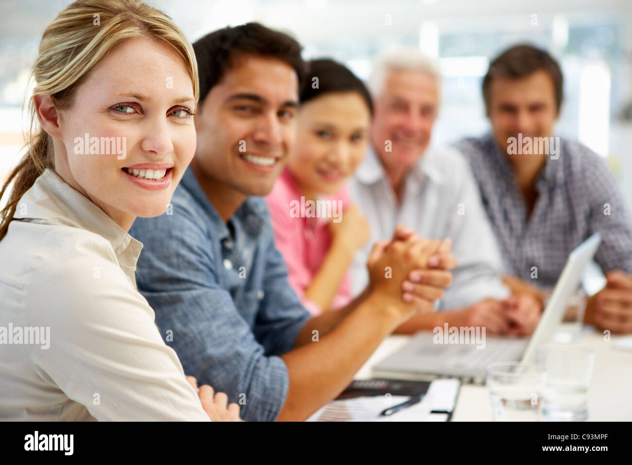 Mixed group in business meeting Stock Photo Alamy