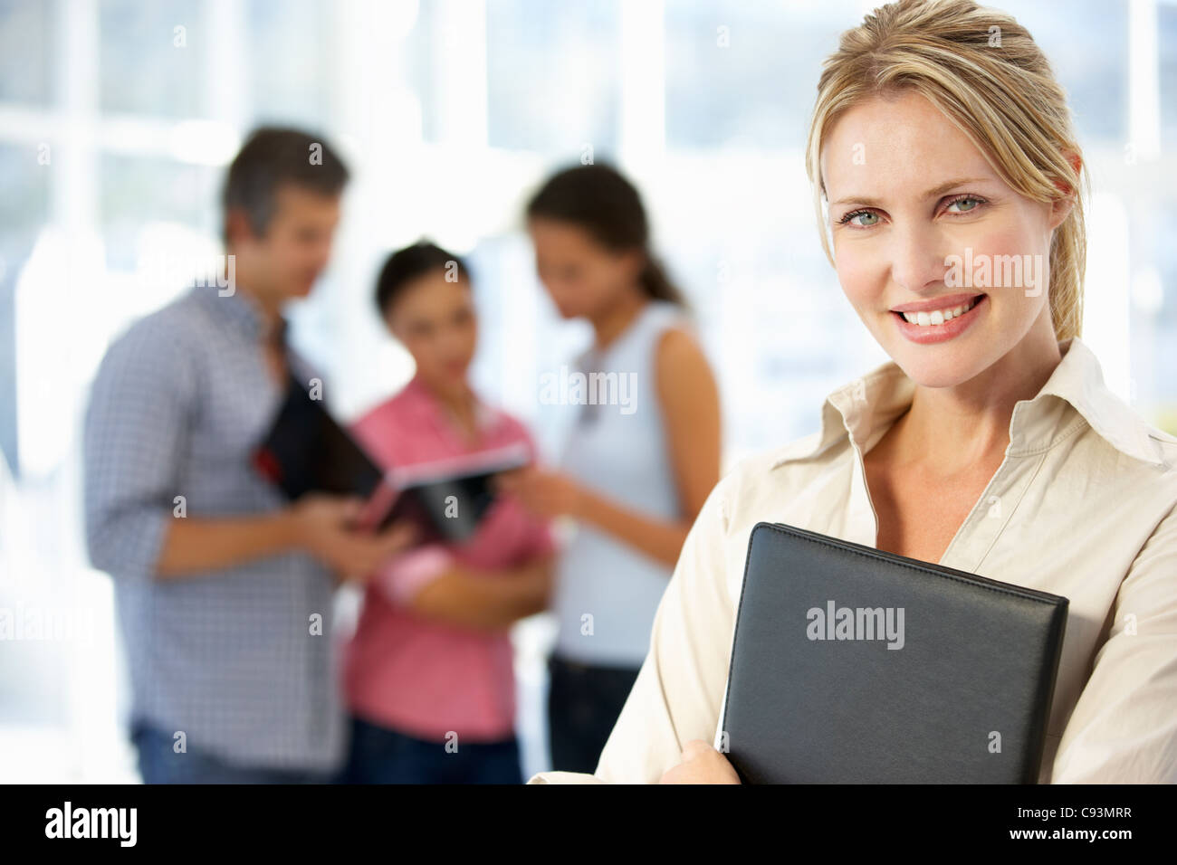 Businesswoman in office Stock Photo