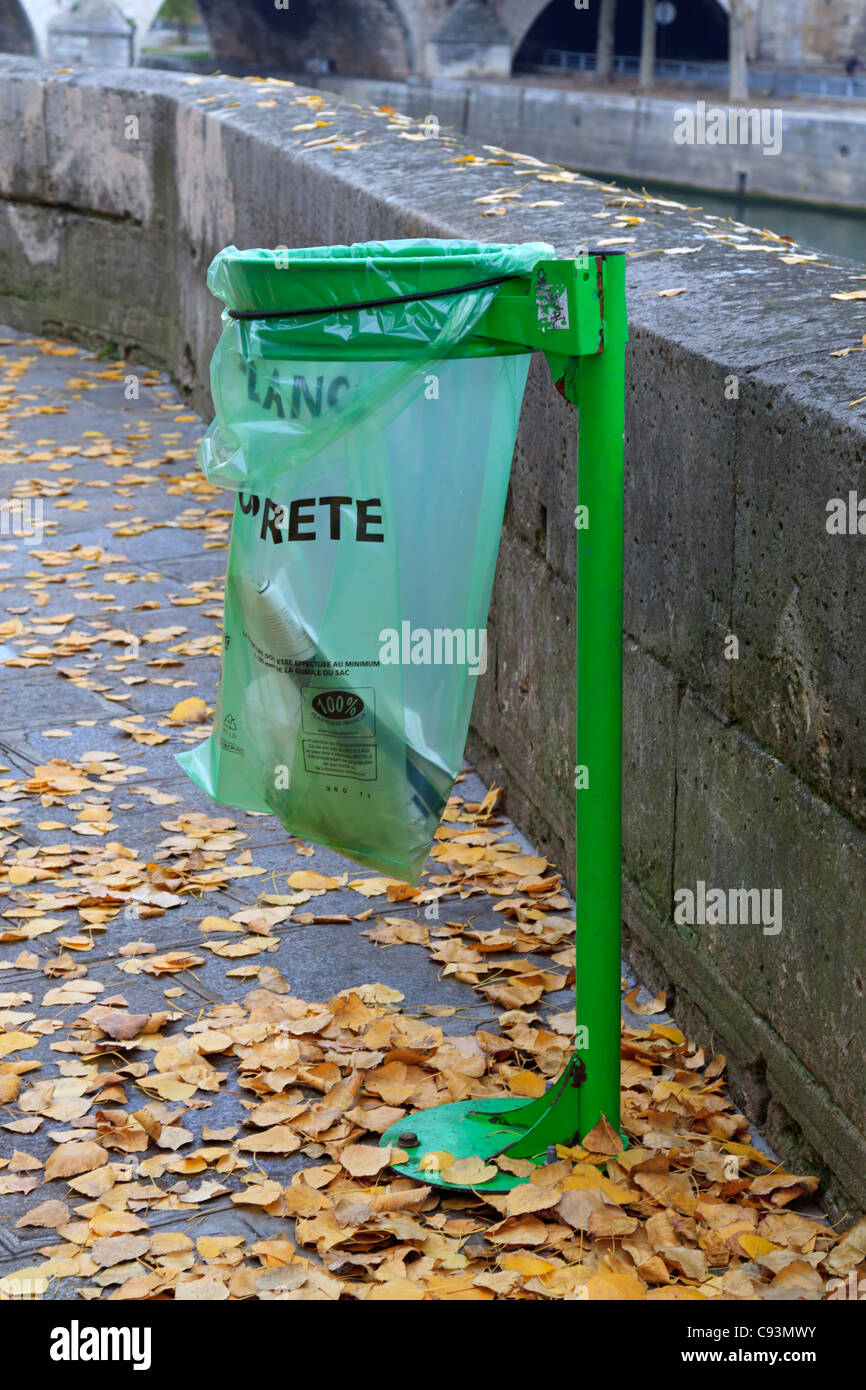 Plastic waste bag in Paris, France. Clear green waste bags of recyclable  plastic are found all over Paris Stock Photo - Alamy